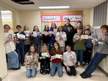 students showing gift from Antarctica