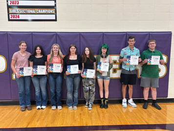 students holding certificates
